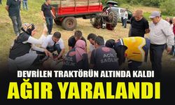 DEVRİLEN TRAKTÖRÜN ALTINDA KALDI AĞIR YARALANDI